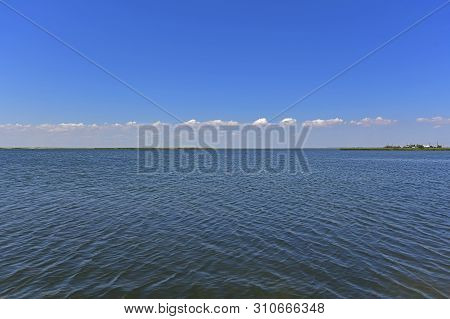 Calm In The Sea Bay. Berdyansk Spit Is Located In The North Of The Azov Sea, Separating The Gulf Of 