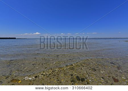 Calm In The Sea Bay. Berdyansk Spit Is Located In The North Of The Azov Sea, Separating The Gulf Of 