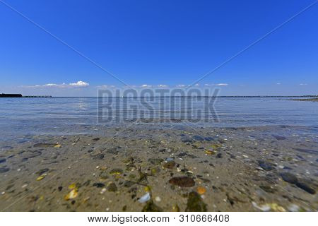 Calm In The Sea Bay. Berdyansk Spit Is Located In The North Of The Azov Sea, Separating The Gulf Of 