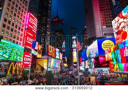 New York City, United States - November 3, 2017:  Night view of illuminated billboards on buldings facades at Times Square.