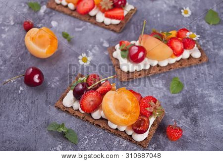 Crisp Bread With Creme Cheese, Fruit And Berries