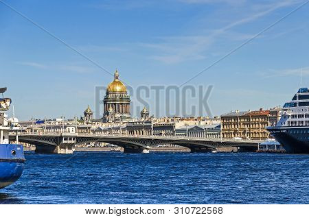 Saint Petersburg, Russia -  June 27, 2018: Saint Isaacs Cathedral Behind The Blagoveshchenskiy Bridg