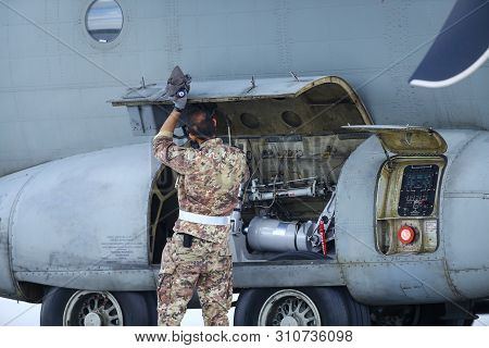 Otopeni, Romania - May 22, 2019: A Mechanic Is Inspecting Parts Of An Alenia C-27j Spartan Military 