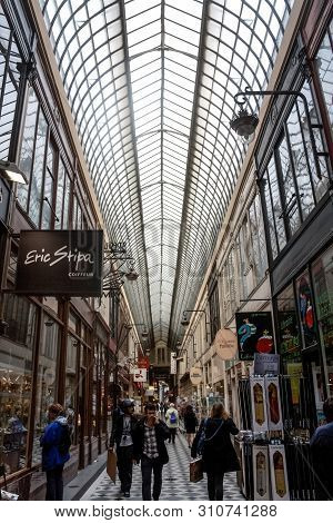 Paris, France - July 11, 2014: Typical Parisian Covered Passage, Passage Jouffroy, Surrounded By Sho