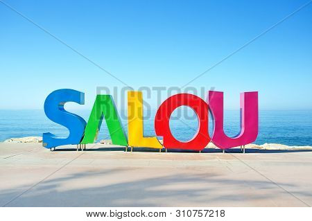 Salou, Spain - July 7, 2019: A Big Colorful Salou Sign At The Sea Coast In Salou City. Travel Concep