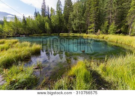 The Green Thermal Lake Near Aktash, Altai Mountains. Summer Time. The Pacifying Landscape Among The 