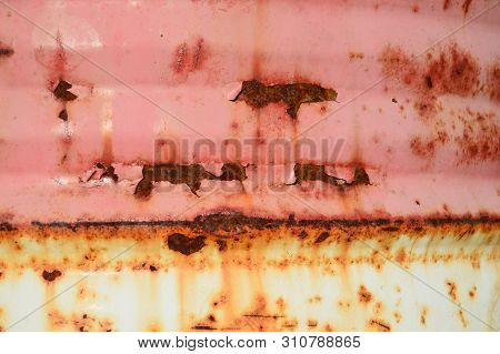 Red Painted Metal Background With Rust. Close-up