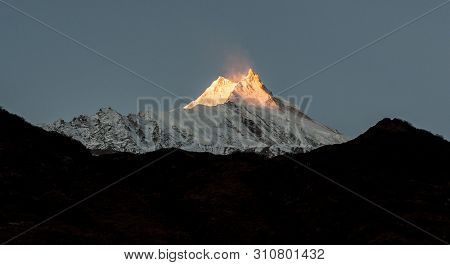 View Of Snow Covered Peak Of Mount Manaslu During Sunrise (8 156 Meters) With Clouds In Himalayas, S
