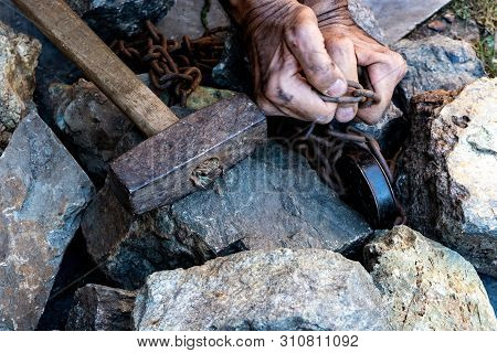 The Hands Of A Slave In An Attempt To Release. The Symbol Of Slave Labor. Hands In Chains.