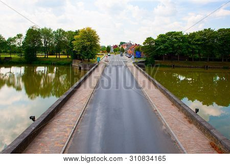 South Road To And From Ieper, Belgium, Beyond Lille Gate Over River