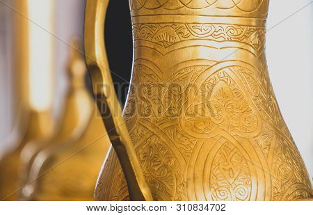 Close-up Of Golden Arabic Brass Coffee Pot.