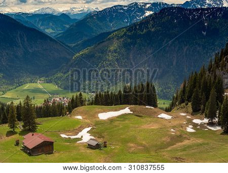 Trail To Mount Wendelstein In Upper Bavaria In The Late Spring, Featuring Green Gras, Rocks And Part