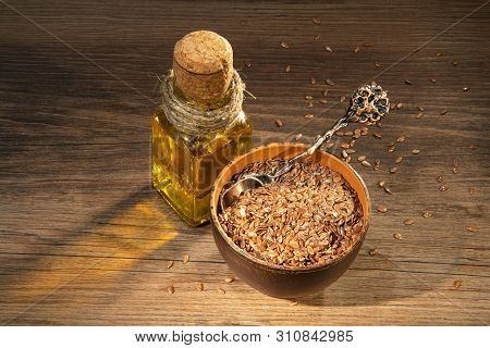 Flax Seeds And Oil On A Table