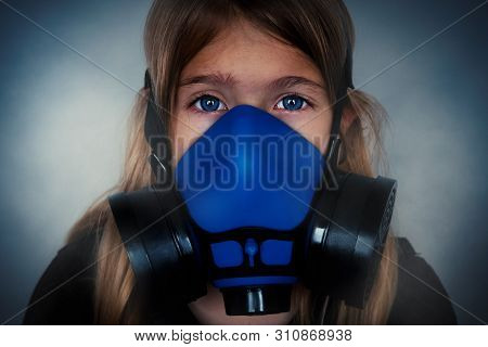Young Girl Wearing Gasmask, Respirator Portrait. Effects Of Worldwide Air Pollution, Industrial Infl