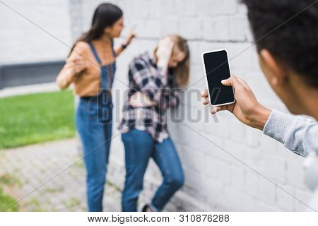 Selective Focus Of African American Boy Shooting Bulling Of Scared Teenager