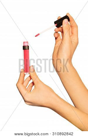 Female Hands Holding Lip Gloss Tube And Applicator