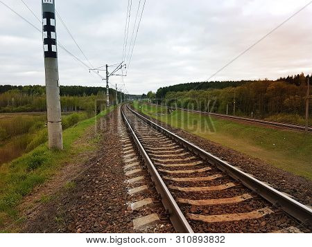 Railway Under Ccloudy Sky, Industrial Concept Background. Railroad Travel, Railway Tourism. Transpor