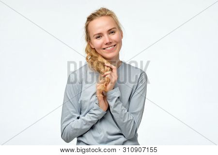 Happy Blonde Girl In Blue Pulover Smiling Looking At Camera