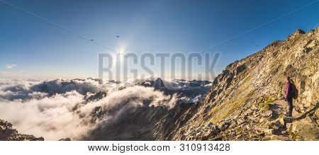 Tourist Looking On Mengusovska Valley With Inversion While Hiking To Rysy Peak In High Tatras, Slova