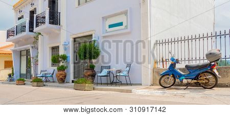 Little European City, Town, Place. Empty Chairs With Table Near The Building. Cafe Exterior Backgrou