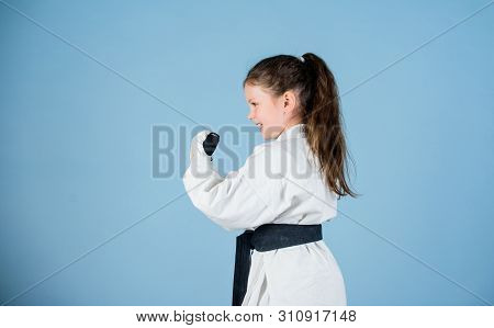 Power And Balance. Sport Success In Single Combat. Small Girl In Martial Arts Uniform. Practicing Ku