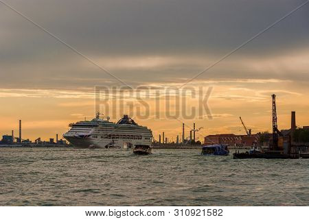 Venice, Italy - April 29: Natural Environment And Pollution In Venice Lagoon. Big Cruise Ship, Ferri