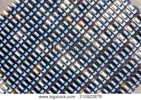Aerial Top View New Cars Lined Up In The Port For Import Export Business Logistic And Transportation