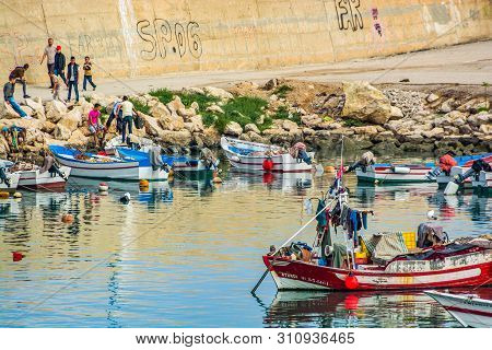 El Jebha, Morocco - October 19, 2013. Marina With Colored Boats By Mediterranean Sea