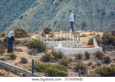 El Jebha, Morocco - October 19, 2013. Muslim Family Visiting Graveyard