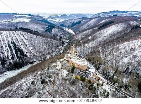 Aerial View Rock With Medieval Castle On It Near Moselle River In Brodenbach Winter With Forest Snow
