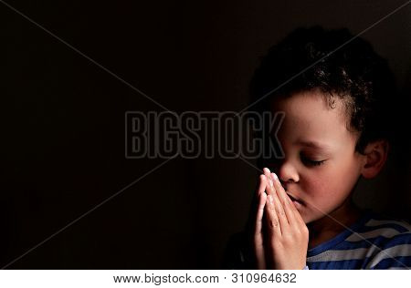 Little Boy Praying To God Stock Image With Hands Held Together With Closed Eyes  Stock Photo