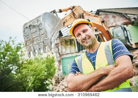Demolition construction work. Worker at building site