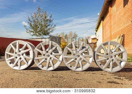 Krasnoyarsk, Russia 12 Jule 2019: Four Old Original Aluminum Toyota Prius Wheels. Used, Outdoors.