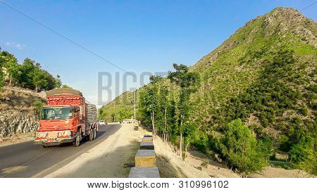 Traffic On The High Altitude Road In The Mountains