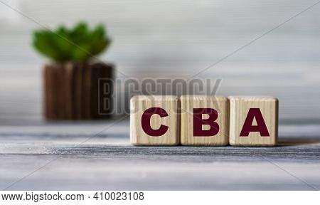 Cba (cost Benefit Analysis) - Word On Wooden Cubes Against The Background Of A Light Board With Beau