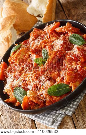 Trippa Alla Romana Roman Style Tripe With Tomato Sauce Closeup In The Plate On The Table. Vertical