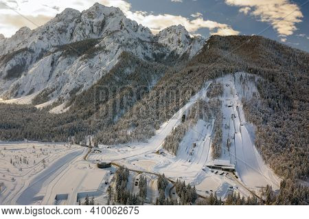 Aerial View Of Ski Jump In Planica, Slovenia At Ratece Near Kranjska Gora In Winter With Snow.