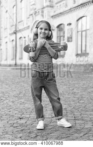New Adventure Awaits. Happy Kid Hold Penny Board Outdoors. Aboveground Transportation. Adventure Tra