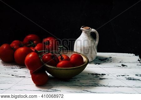Fresh Oraganic Tomatoes On A Branch