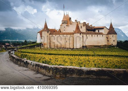 Chateau De Aigle, Small Winemaking Village In The Swiss Alps, With The Medieval Castle Emerging From
