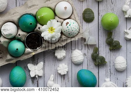 Green And White Easter Eggs In Egg Carton. Candle Egg, Gypsum Egg, Poultry Egg With Ground And White