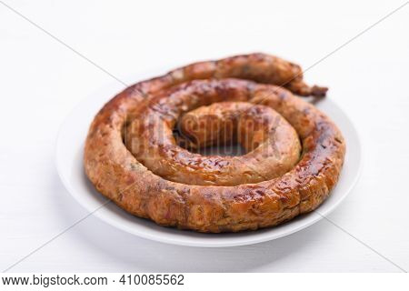 Northern Thai Sausage (sai Aua), Grilled Intestine Stuffed With Minced Pork, Spices And Herbs On Whi