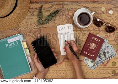 Huzhou, China, 27 February 2021: Planning Vacation, Travel Plan, Trip Vacation Using World Map With 