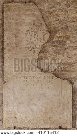 San Giorgio Di Valpolicella, Italy - 02 22 2021: Epigraph On Marble Slab In The Cloister Of The Hist