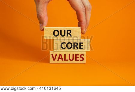Our Core Values Symbol. Concept Words 'our Core Values' On Wooden Blocks On A Beautiful Orange Backg