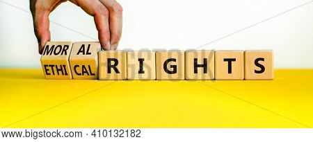 Ethical Or Moral Rights Symbol. Businessman Turns Wooden Cubes And Changes Words Ethical Rights To M