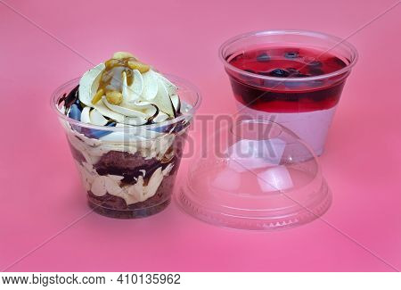 Desserts With Chocolate And Berries In Plastic Cups. Dessert With Cream And Chocolate And Curd Fruit