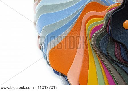 Different Colors Of Samples Of Leatherette Copy Space. Colored Leatherette Catalog On A White Backgr