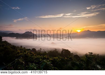 Foggy Landscape View On Mountain Agints Sky