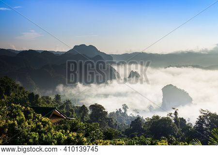 Foggy Landscape View On Mountain Agints Sky